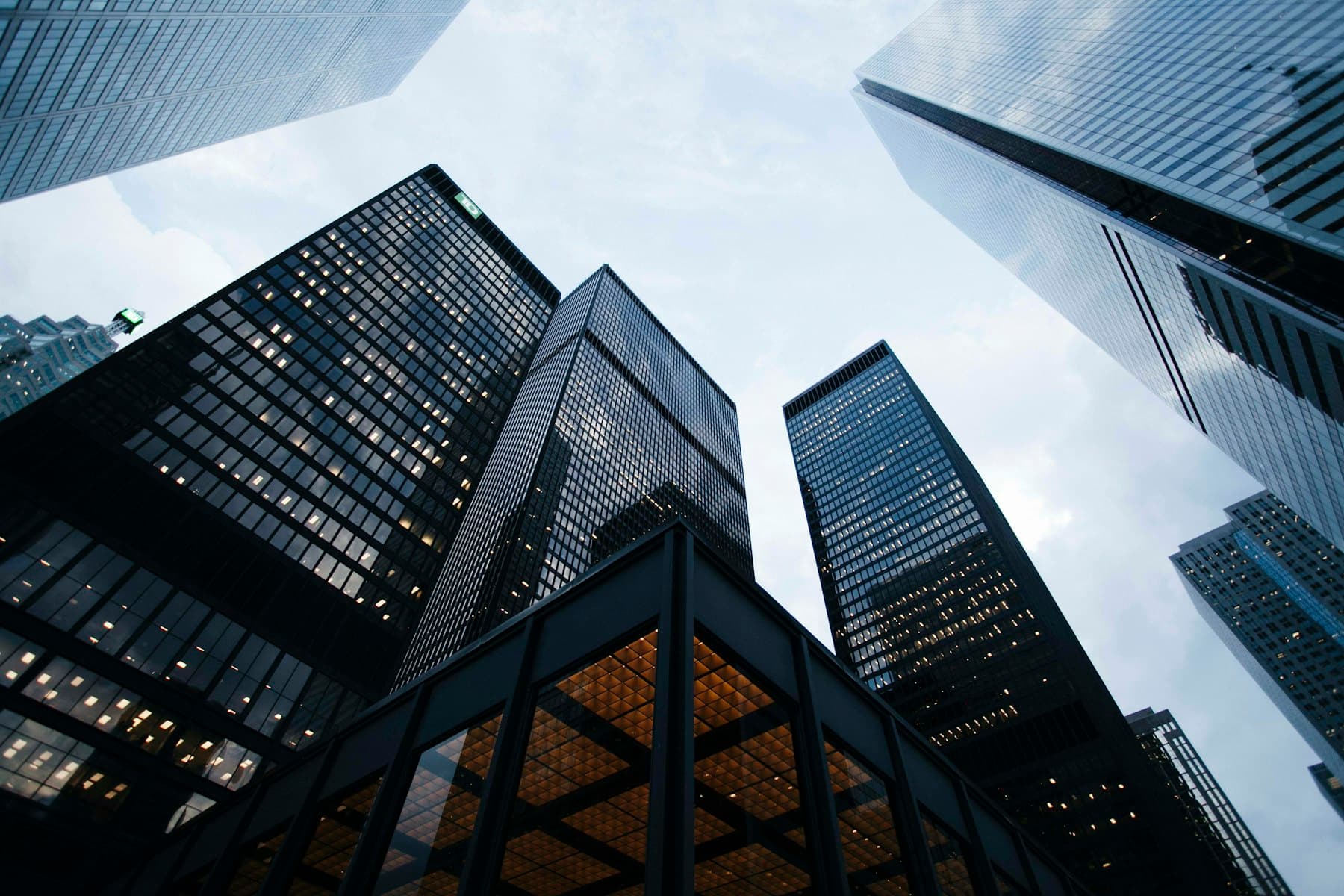 High-rise towers viewed from below — three decades of large-scale construction expertise.